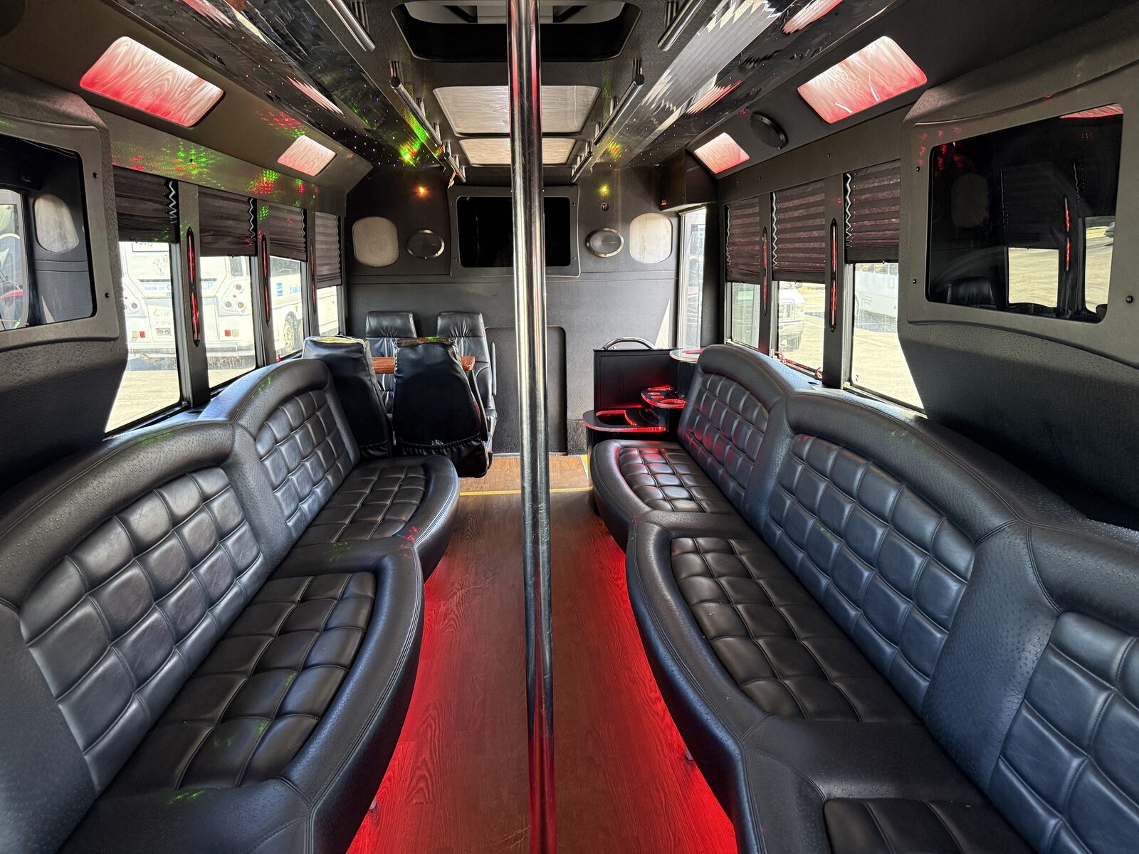 Luxury leather party bus interior with color-changing LED lighting
