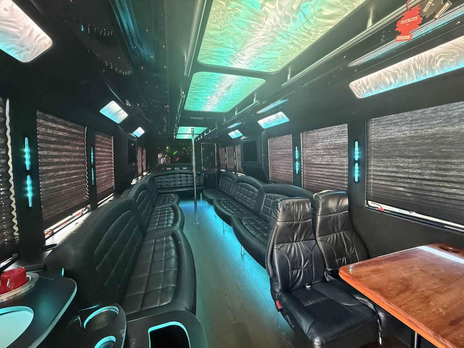 Luxury leather party bus interior with color-changing LED lighting