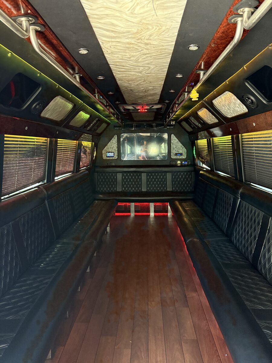 Glam party bus interior with diamond-stitch panels and LED lighting
