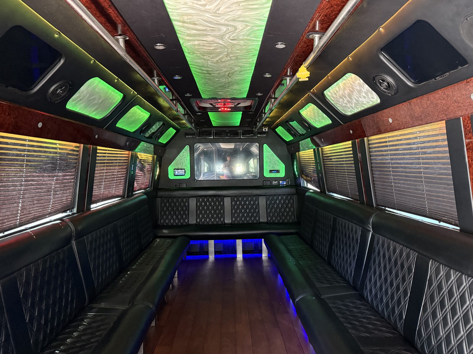 Glam party bus interior with diamond-stitch panels and LED lighting