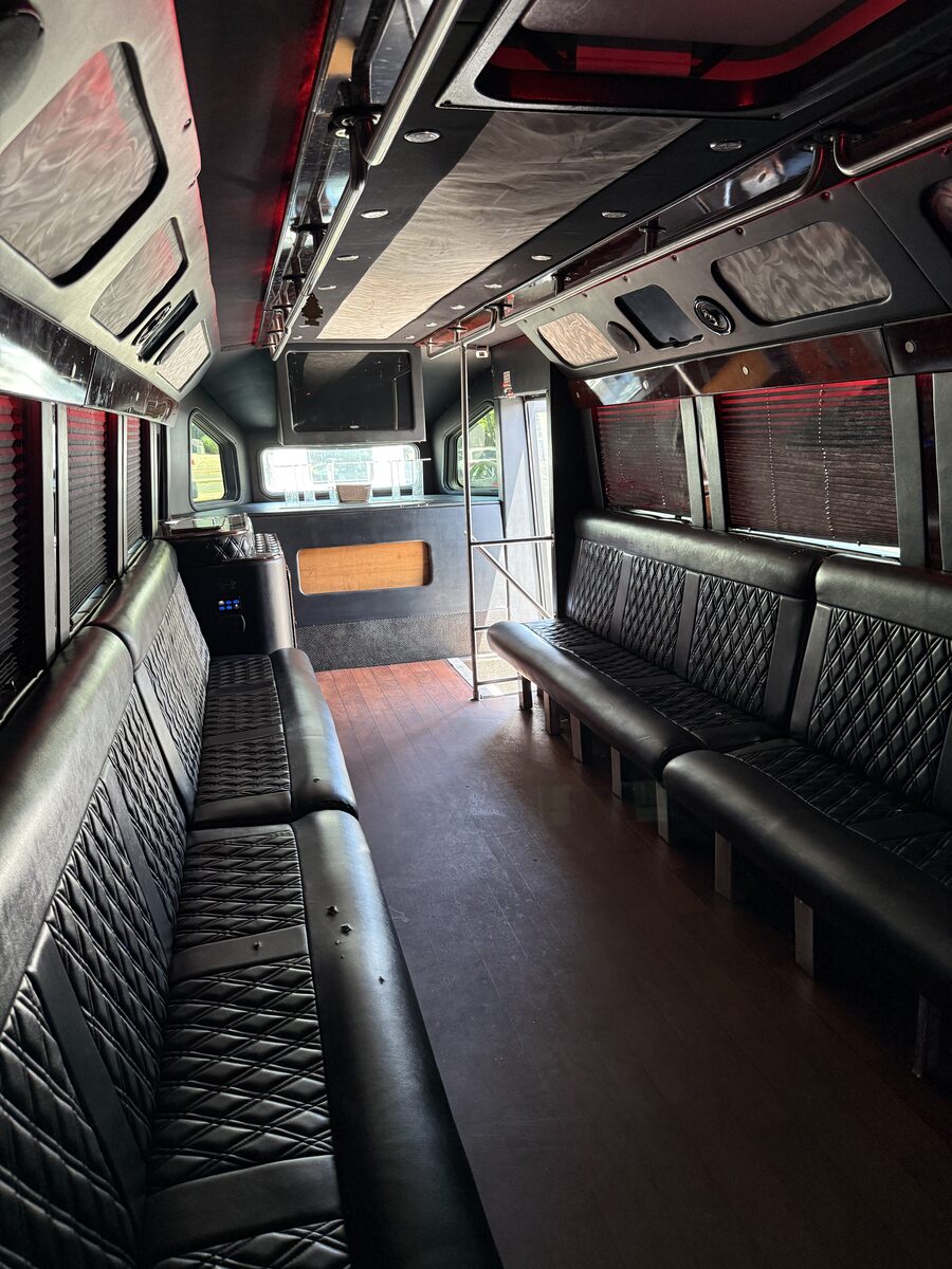 Glam party bus interior with diamond-stitch panels and LED lighting