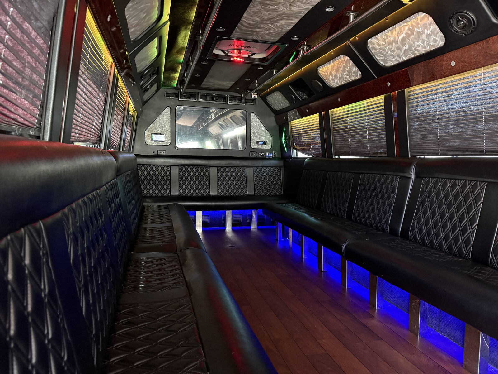 Glam party bus interior with diamond-stitch panels and LED lighting